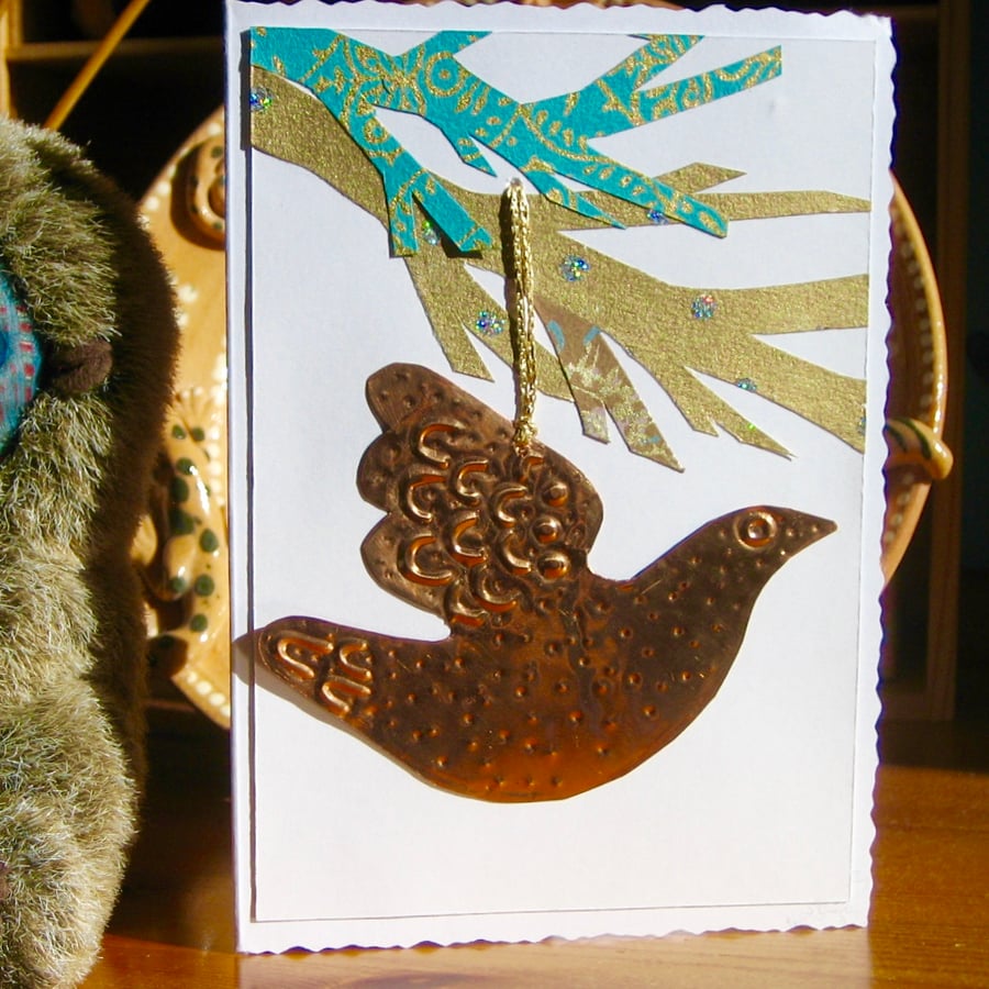 Greetings card with copper bird decoration