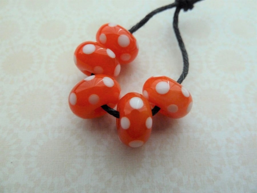orange and white polka dot lampwork glass beads