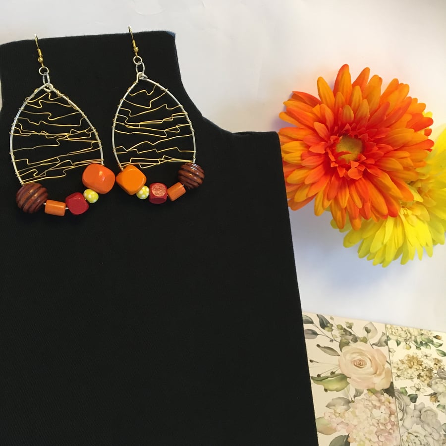 Bright and Bold wood beads wire wrapped hoop earrings.