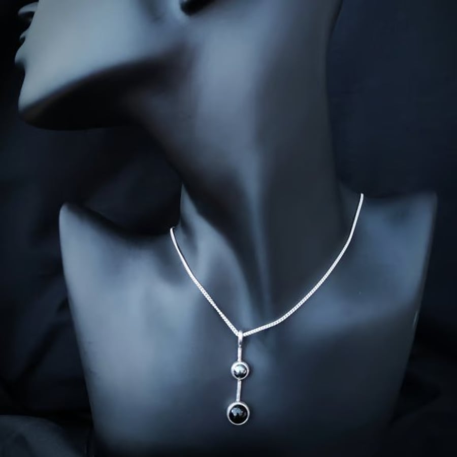 Silver pendant with hematite and onyx