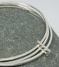 Isidora by Fedha - stylish set of three polished silver bangles with silver link - Image 3