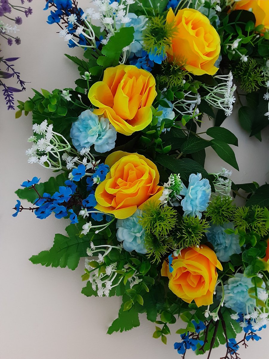 April. 40cm wreath yellow, green and blue.