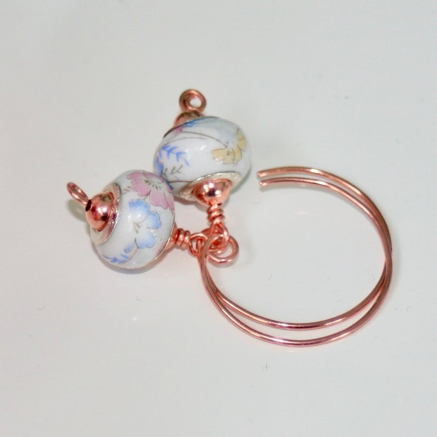 Floral ceramic bead and copper hoop earrings