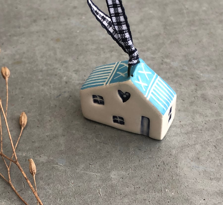 Ceramic hanging house decoration .