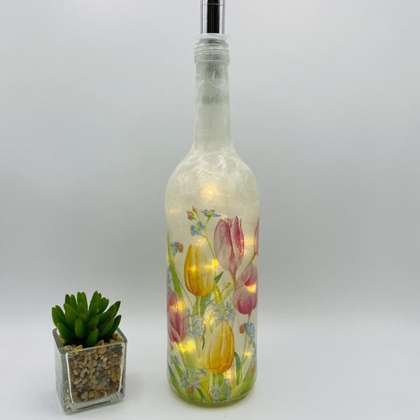 Decoupage bottle light with tulips and forget-me-nots