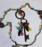 Boho Antique Bronze Multi Coloured Flower & Key Charm Pendant Necklace - Image 1