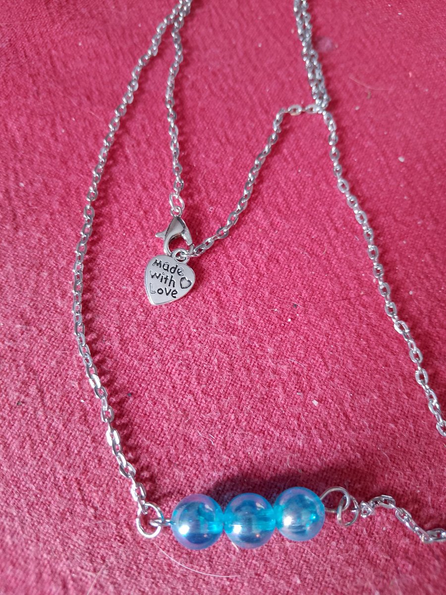 Handmade silver plated necklace with blue beads.