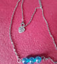 Handmade silver plated necklace with blue beads.