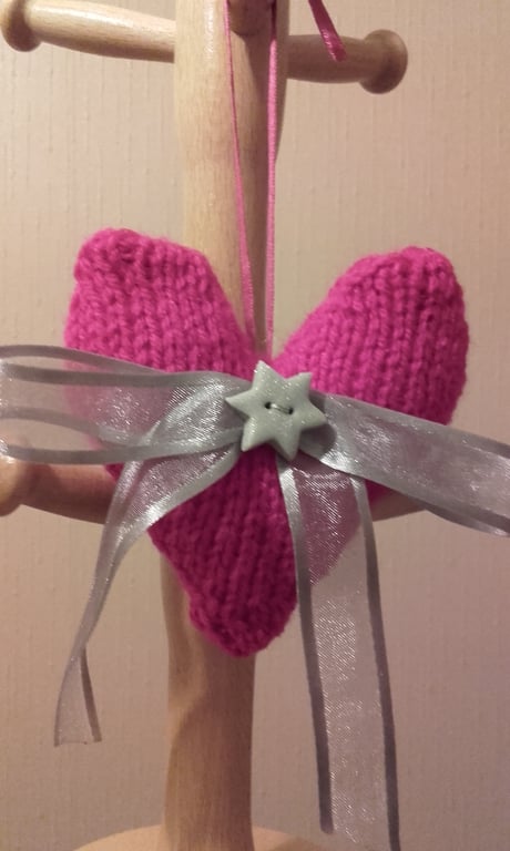 hand knitted pink heart with silver bow and star, pink heart with bow