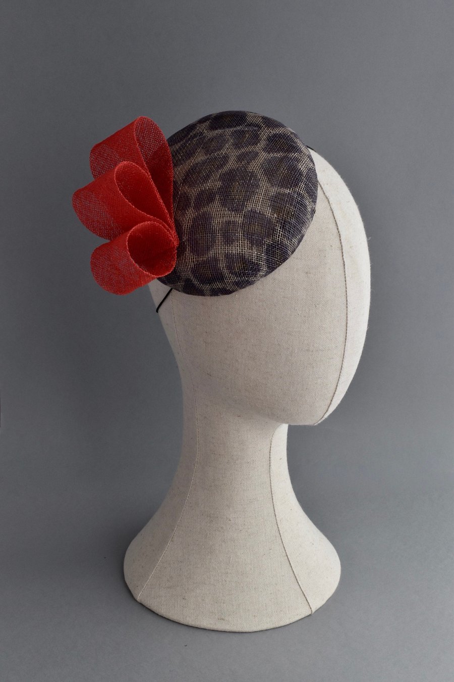 Handcrafted Leopard Print Hat with a Red Bow