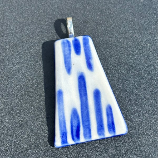 Handmade ceramic pendant blue stripes ; silver coloured bail add to a necklace