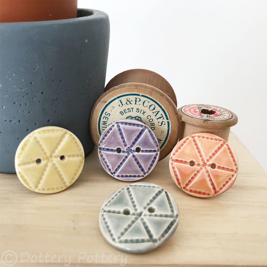 Set of four ceramic handmade buttons