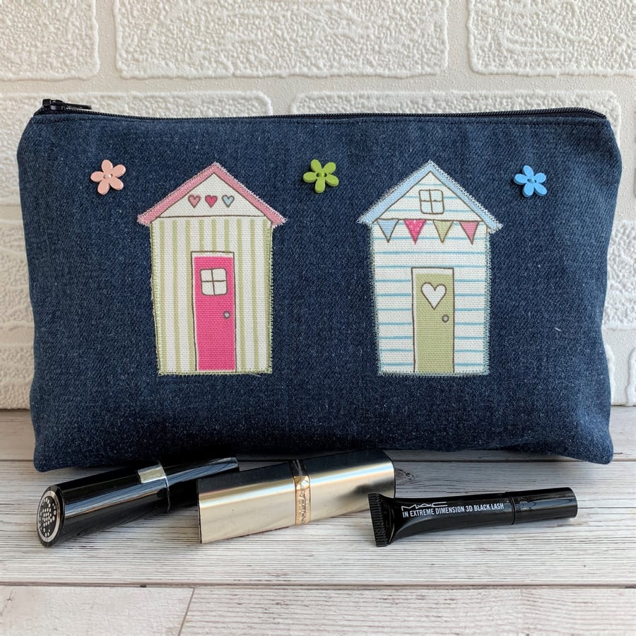 Large dark blue denim make up bag with pastel beach huts and flower buttons