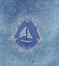 Sailing ship embossed in blue embroidery thread on a blue hand towel