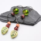 copper earrings, green ceramic leaf