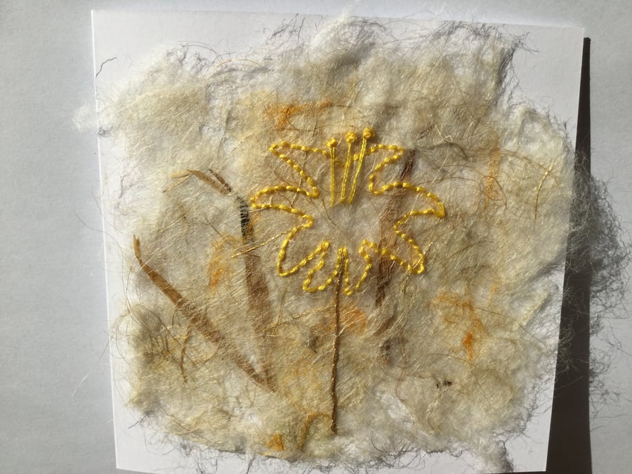 Embroidered yellow flower on handmade silk paper greeting card 