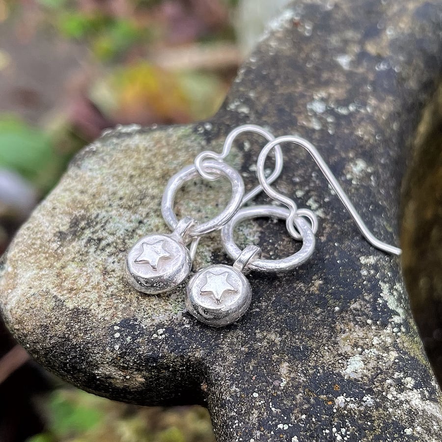 Silver star drop earrings