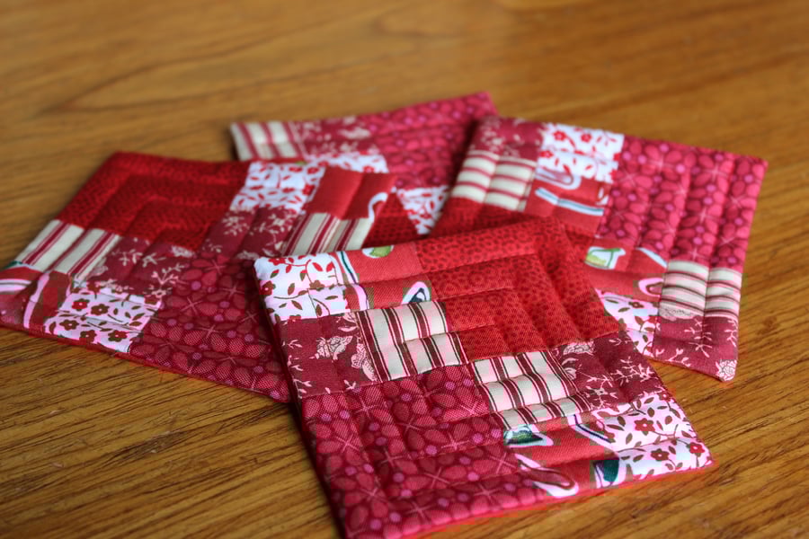 Set of four red patchwork coasters