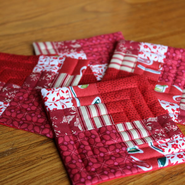 Set of four red patchwork coasters