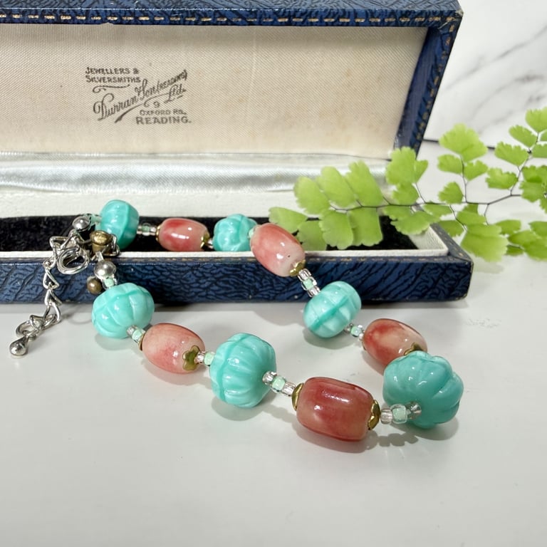 Teal and pink glass bead bracelet with extender chain. 