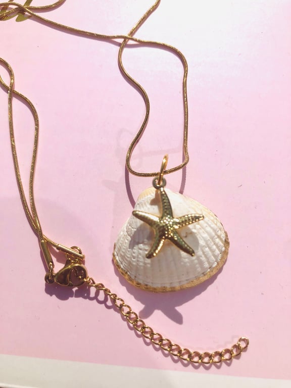 Ocean jewellery - Natural shell trimmed with gold colour pendant on necklace