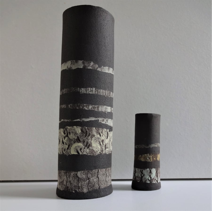 Hedda. Matt  black ceramic vase with bands of colour