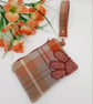 Check clutch bag with clip on handle and flower applique.  - Image 1