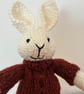 Small Hand Knitted Rabbit in Rust Sweater and Trousers  - Image 2