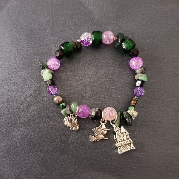 Elasticated spooky silver charm bracelet with purple, green and black beads