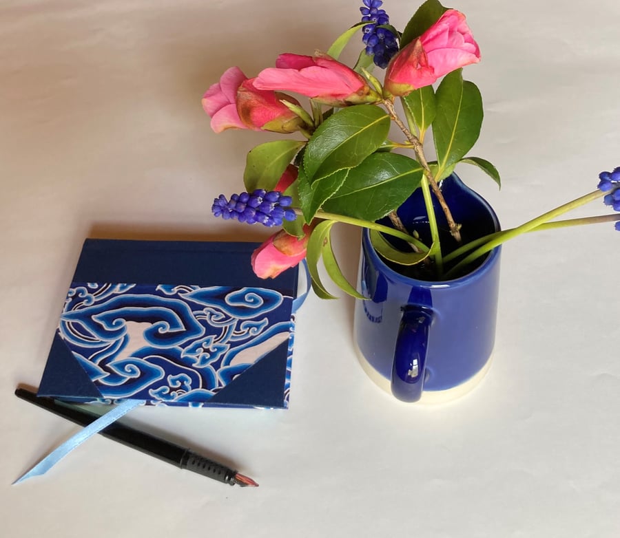 Small notebook with swirly blue cover