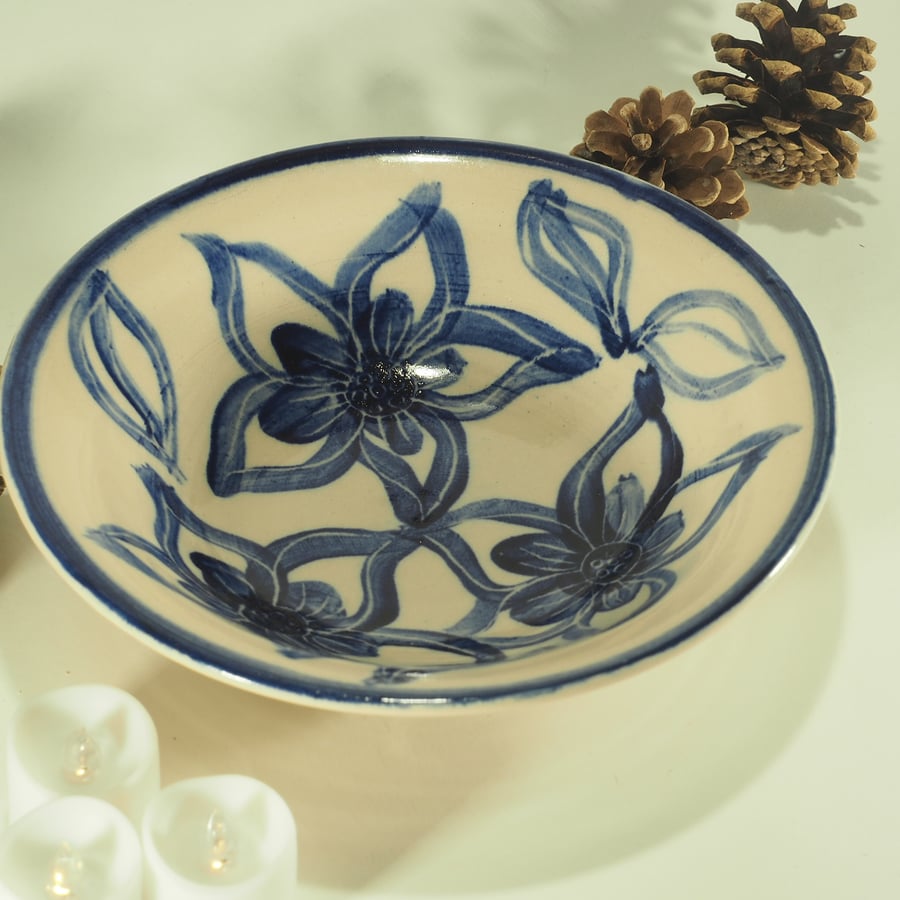 Ceramic hand-painted bowl with blue and white flower design