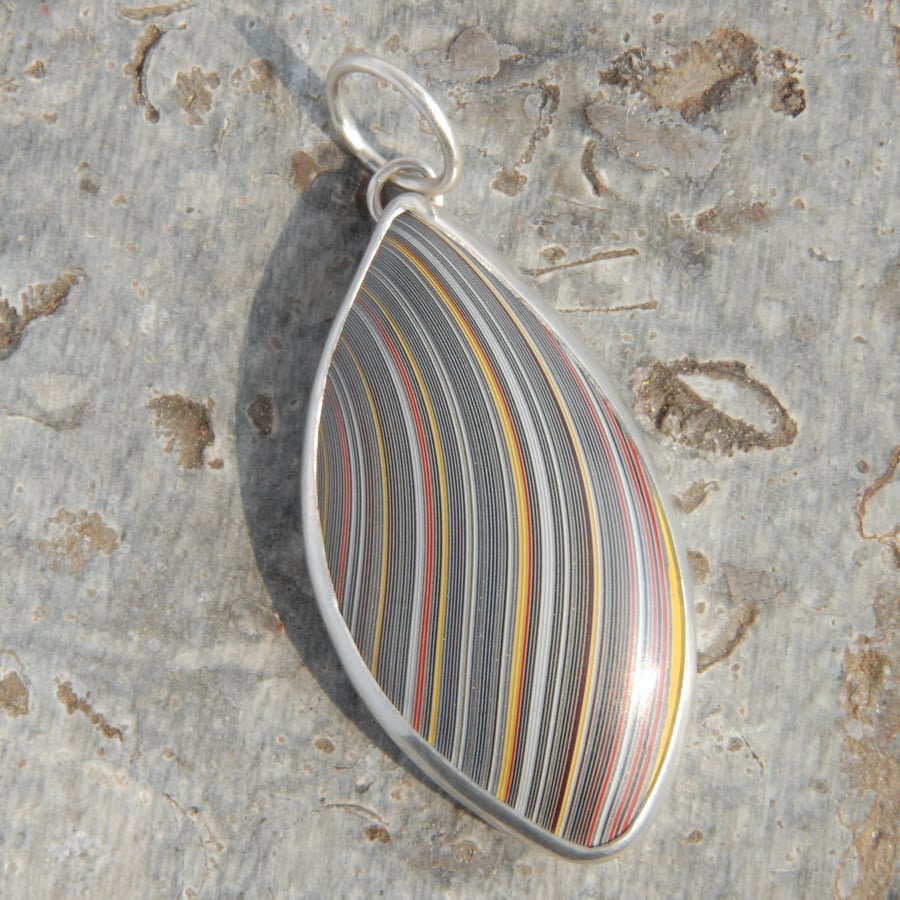 Unisex fordite and sterling silver pendant