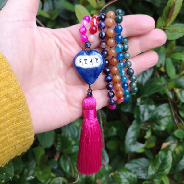 Rainbow gemstone mala bead necklace with ceramic heart and pink tassel