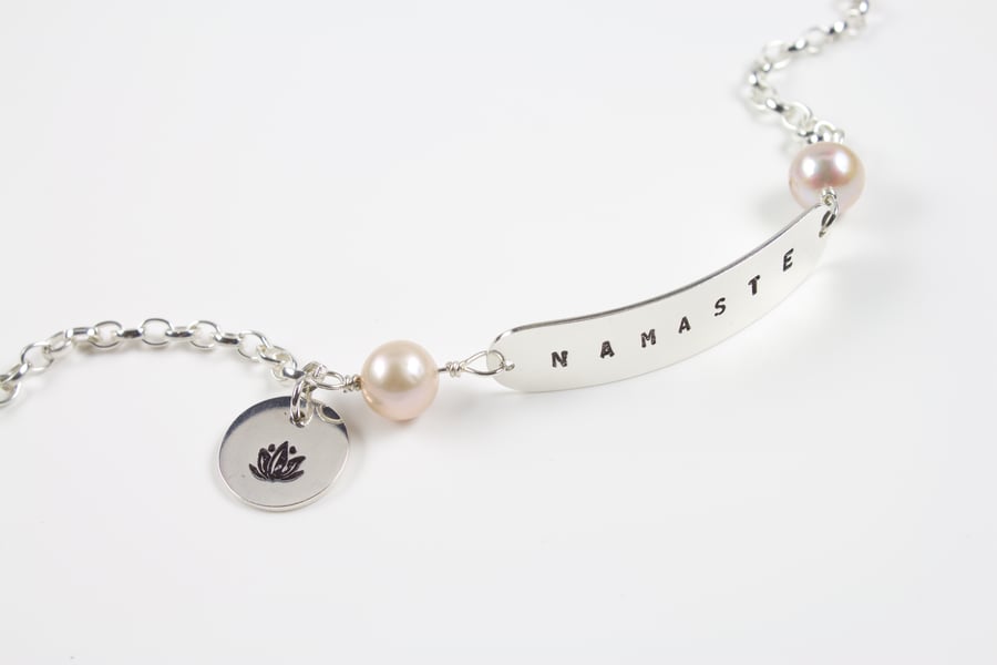 Sterling Silver 'Namaste' Text Bracelet with Lilac Pearls and Lotus Flower Charm