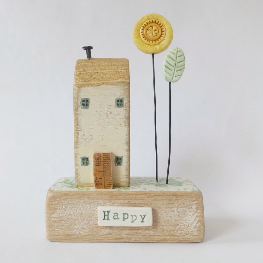 Little wooden house with sunflower garden 'happy'