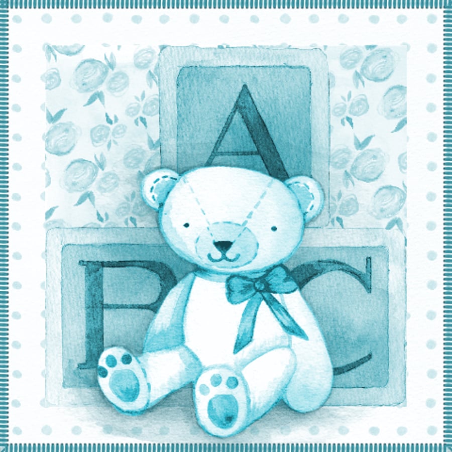 new baby boy with teddy and ABC bricks