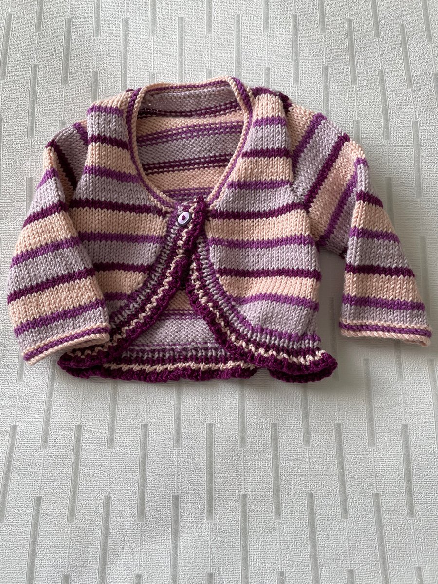 Striped long sleeved baby bolero knitted in a luxury yarn