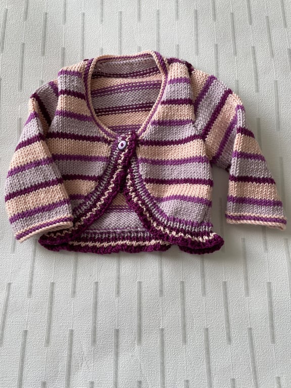 Striped long sleeved baby bolero knitted in a luxury yarn