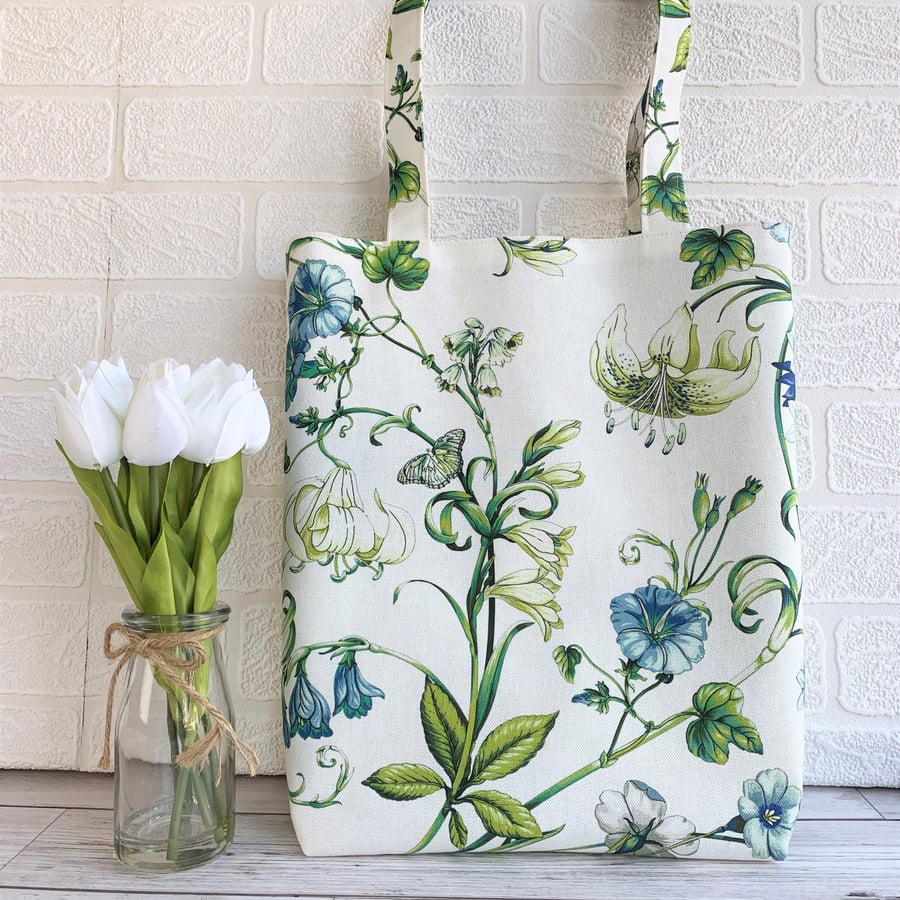 Floral tote bag with cream and blue flowers and cream butterfly