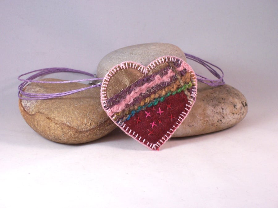 Love heart machine and hand embroidered textile necklace in pinks 