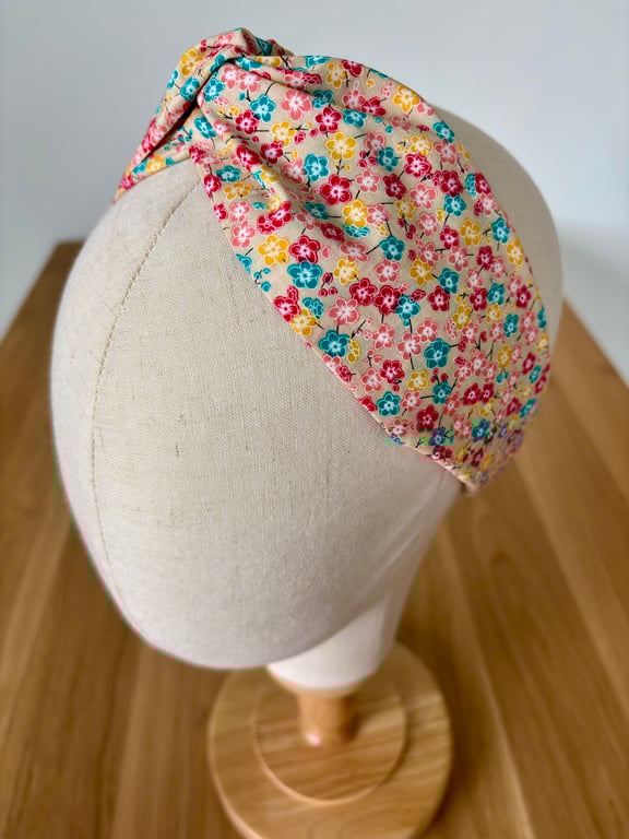 Cotton headband, twist knot style hairband in a bright floral print 