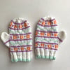 Fair isle pattened baby mittens with thumbs.