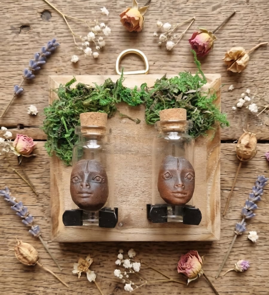 Empty spell jars on customised rack.