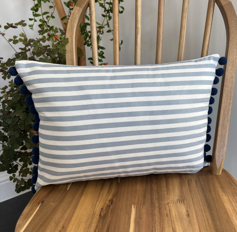 Coastal cushion cover in blue and white stripes with navy pom-poms , 31cm x 46cm