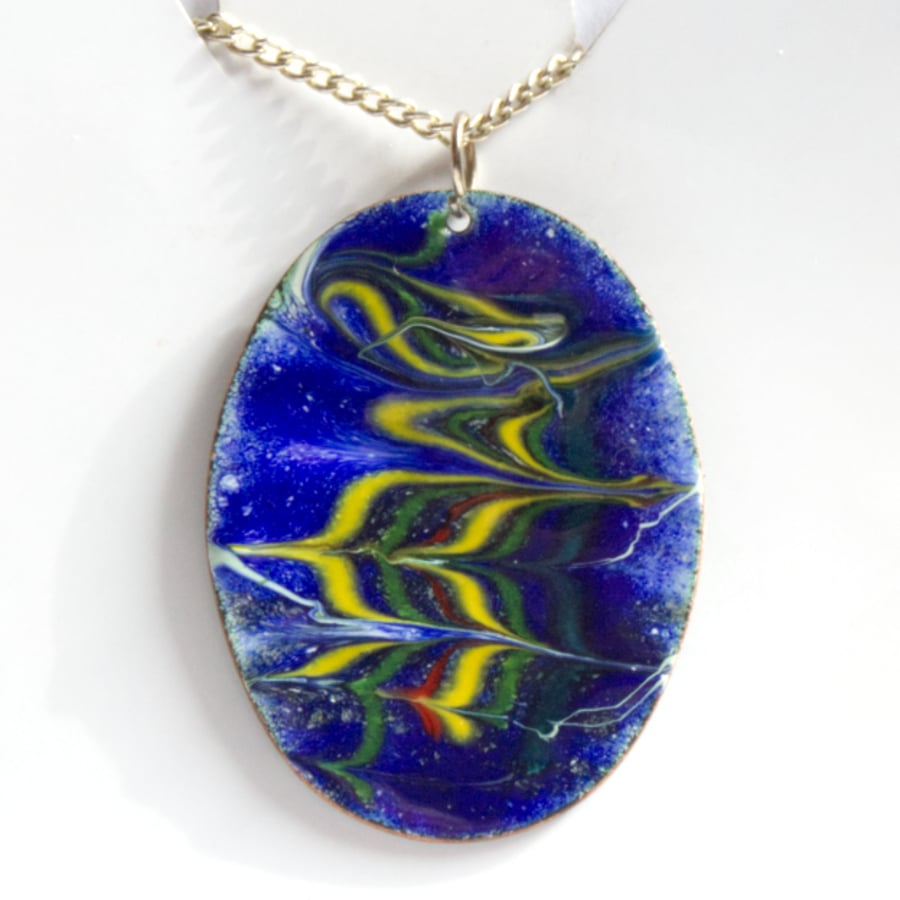 green, yellow, red scrolled over blue on white - pendant