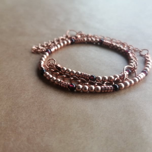 Garnet, hematite and rose ball necklace with a rose gold chain.