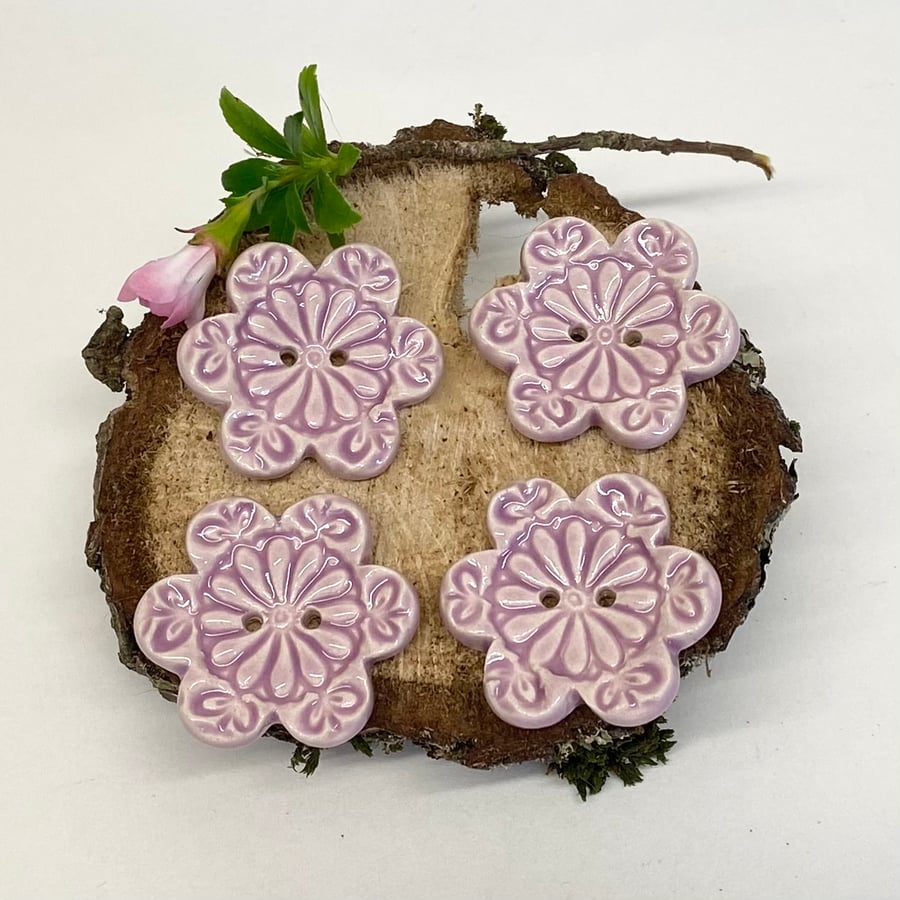 Set of four flower shaped ceramic handmade buttons pink