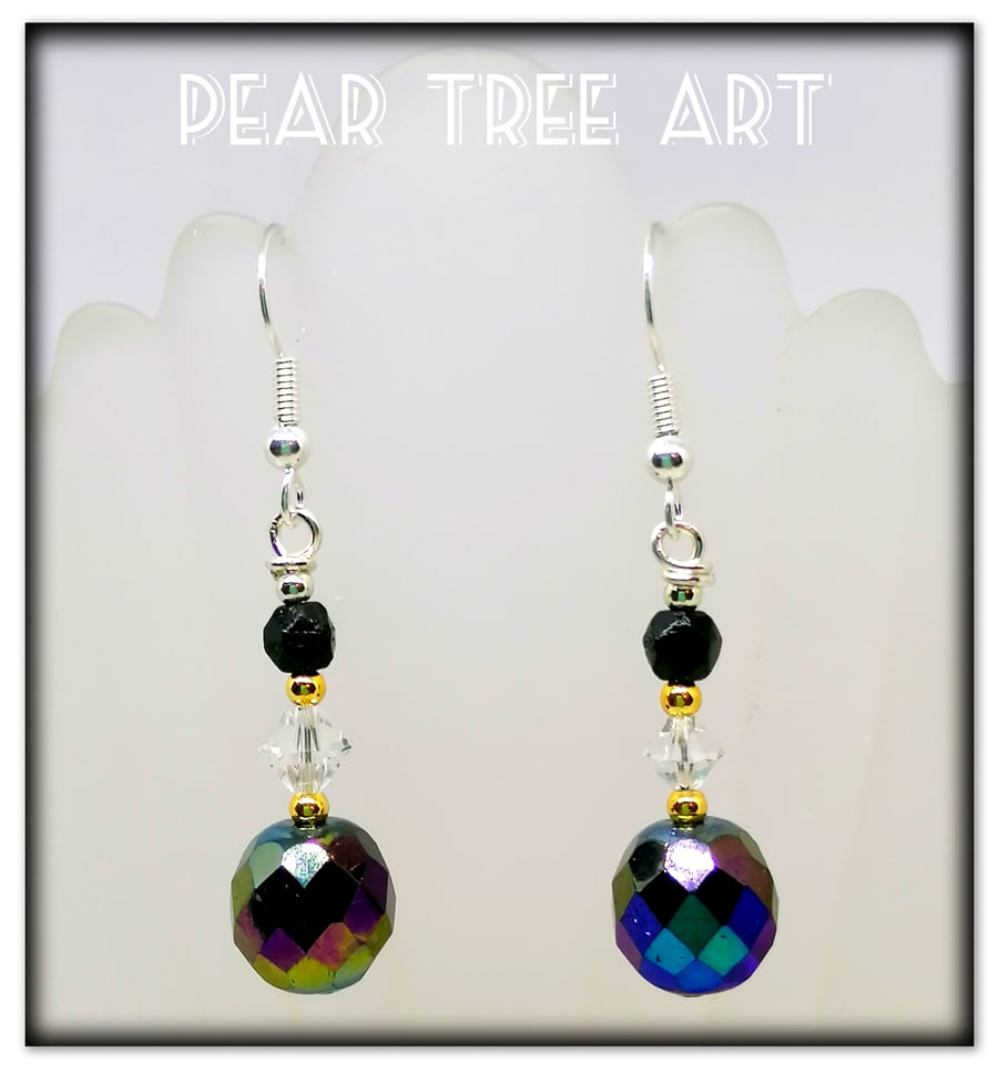 Glass iridescent bead earrings with clear crystal beads on Silver plated hooks.