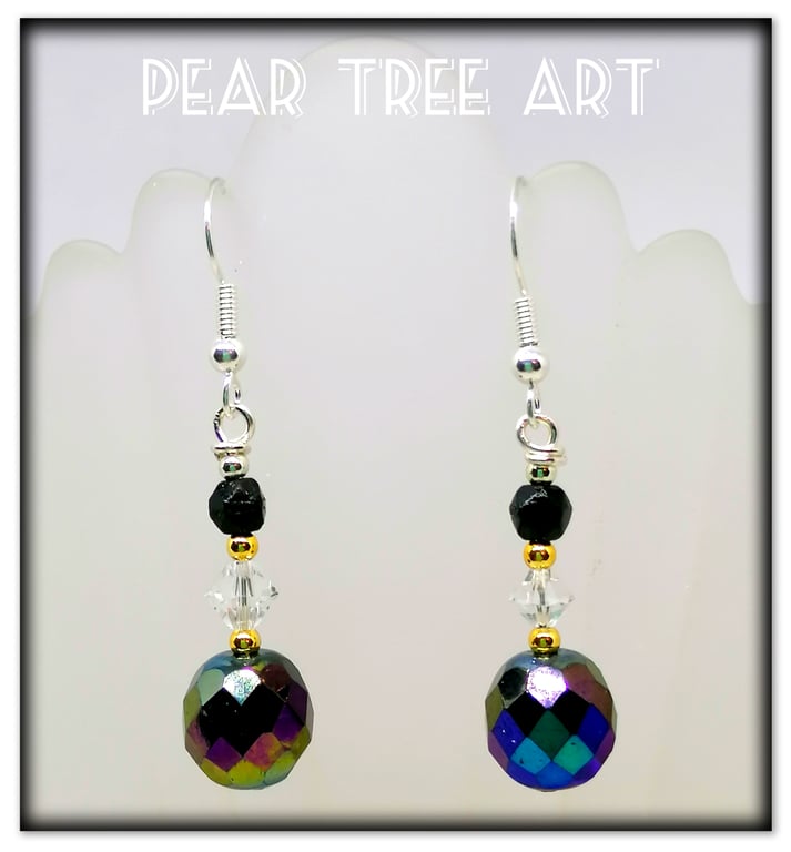 Glass iridescent bead earrings with clear crystal beads on Silver plated hooks.