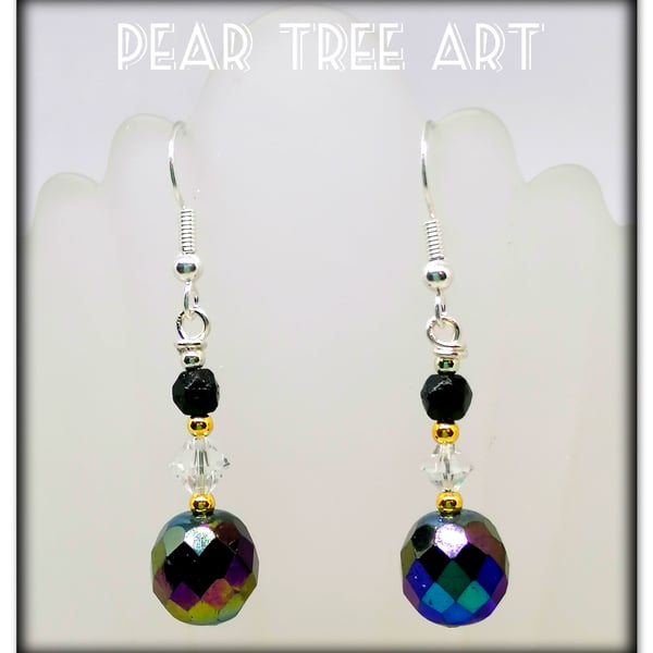 Glass iridescent bead earrings with clear crystal beads on Silver plated hooks.